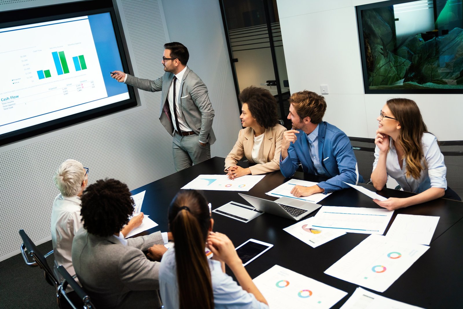 Business colleagues in conference meeting room during presentation